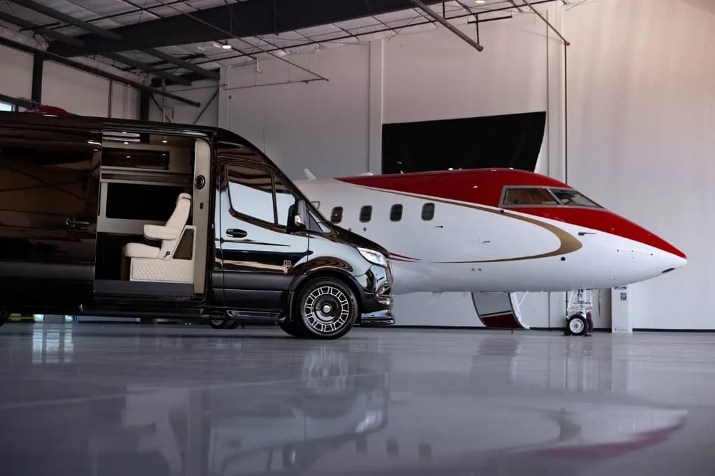 SprintVIP Mercedes Sprinter with private jet inside hangar