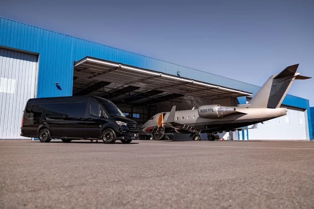 SprintVIP Mercedes Sprinter on tarmac beside private jet